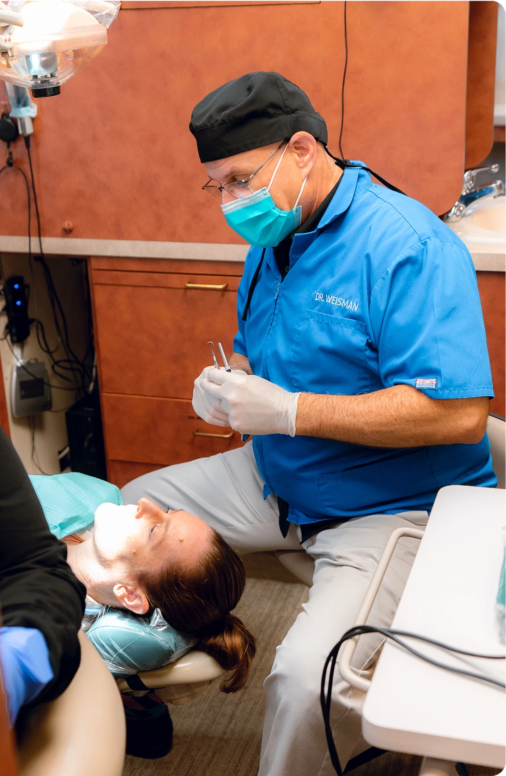 Dr. Weisman consulting with a patient about a smile makeover at Bay Area Dental Fremont CA