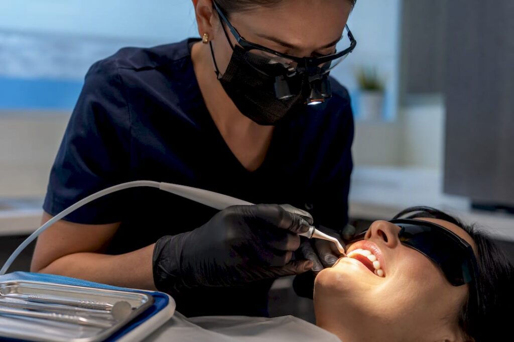 Clinician performing laser gum contouring