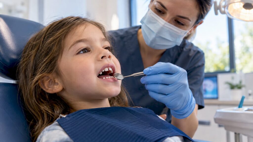 Child receiving an open bite dental evaluation