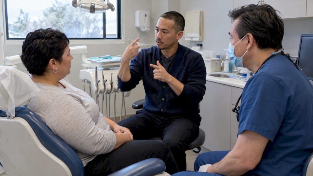ASL interpreter signing during a dental visit